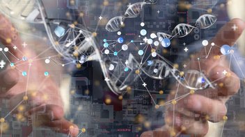  A DNA sample floats between a person's hands