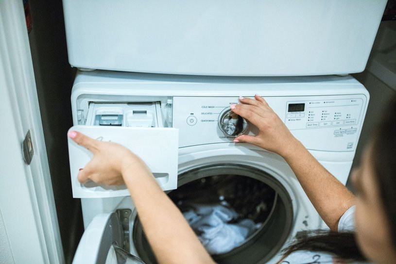 Woman-wahsing-machine Window washing machine with a woman's hands on it.