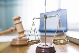 justice-scale.jpg Close-up on a scale and a hammer of justice.