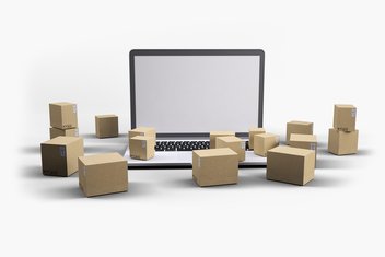 A computer surrounded by parcels and packages