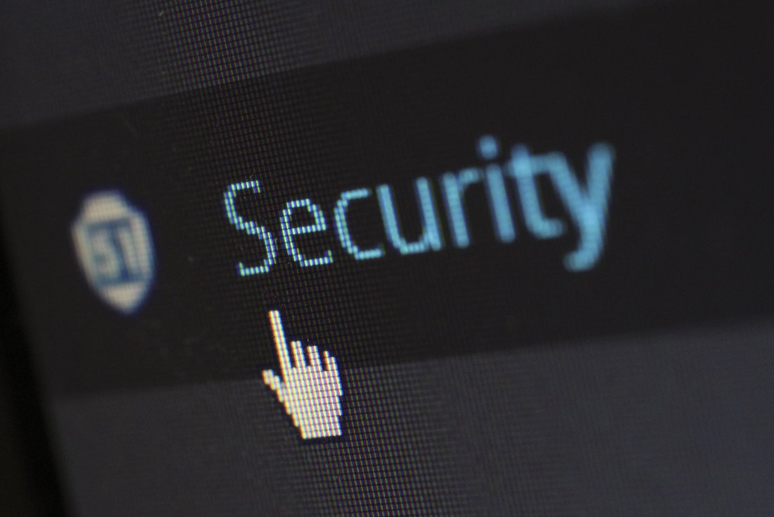 A computer screen shows the mouse pointer pointing to the word "Security"