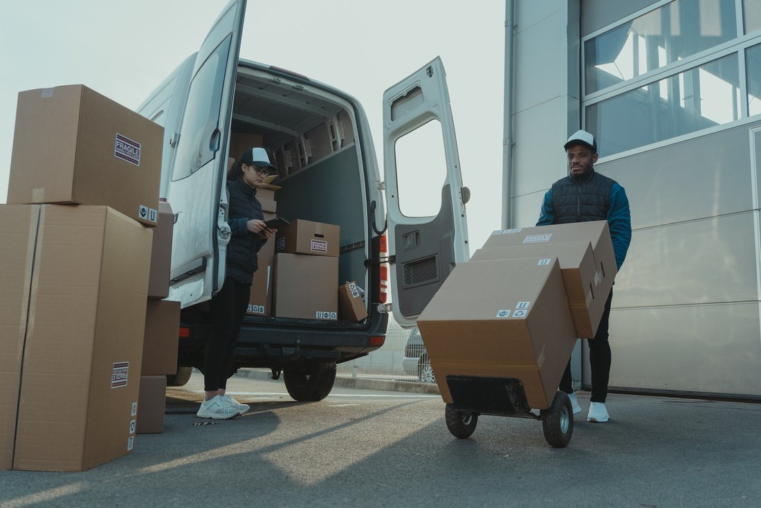 A man unloading packages from a truck
