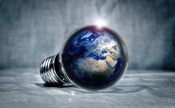 A light bulb contains the globe of planet Earth