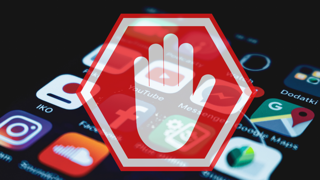 A sign symbolizing a raised hand prohibits access to applications on phones