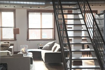rental-apartment-decoration.jpg The inside of an apartment with a staircase.