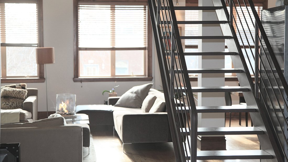 rental-apartment-decoration.jpg The inside of an apartment with a staircase.